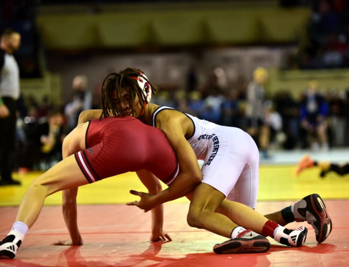 Cascia Hall wrestler Gerald Harris III (right) competes against Tuttle's Chance Fisher in the Class 4A 120-pound weight class finals on Feb. 24, 2024. Harris defeated Fisher, 5-1, although Tuttle did go on to win the 4A team title for the 16th consecutive season.